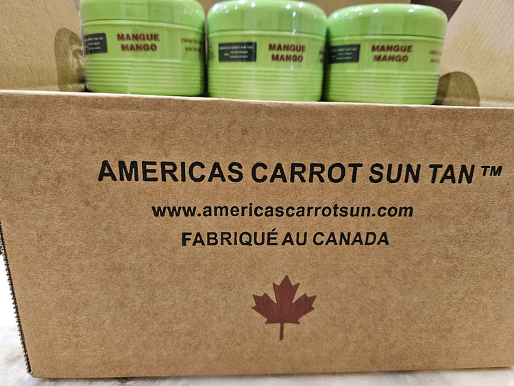 Three green containers labeled 'Mango' on a cardboard box with 'Americas Carrot Sun Tan' branding.