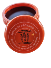 A container of Americas Carrot Sun Tan tanning cream with a red.